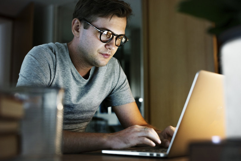 Businessman grinding through tedious business tasks