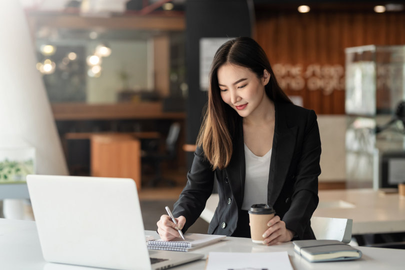 Charming businesswoman using business solutions